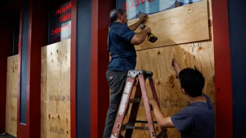 Reuters Residents make preparations for the storm in New Orleans