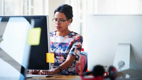 Getty Images Woman working in an office
