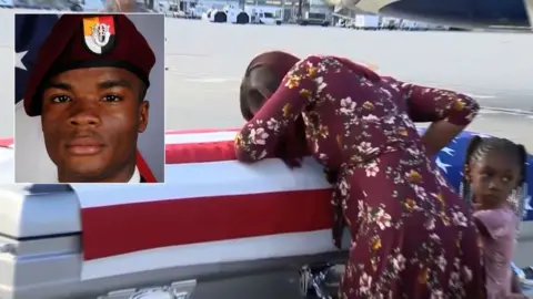 CBS News/US Army Sgt Johnson's widow with his coffin at Miami International Airport, 17 Oct 17