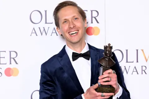 Getty Images Will Close, winner of the Best Actor in a Supporting Role award for "Dear England", poses in the winners room at The Olivier Awards 2024 at The Royal Albert Hall on April 14, 2024 in London, England