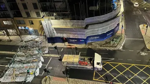 PA Media Photo showing scaffolding blown down in Greenwich, London