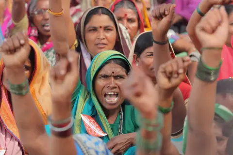 Getty Images Farmers near Mumbai protesting for better compensation