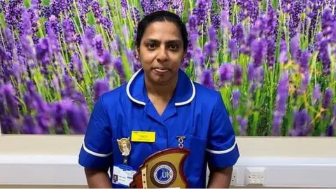 Queen Elizabeth Hospital Tincy Jose with award