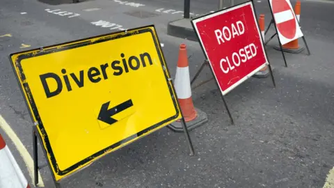 Getty Images Two signs