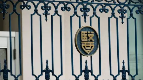 AFP The emblem of the Tokyo Medical University is seen on the building's entrance gate in Tokyo on August 8, 2018.