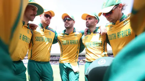South Africa players in a huddle before the 2024 T20 World Cup final