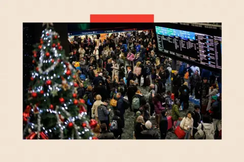Shutterstock Passengers wait for train services to travel from Euston Station 