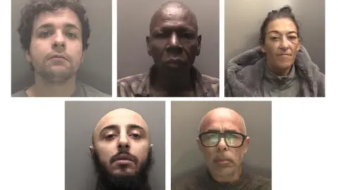 CPS The five group members in mugshot pictures.