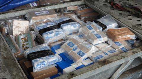 Part of the 600kg haul of cocaine and heroin found at the farm near Mold, Flintshire, discovered in a trailer compartment, wrapped in plastic blocks