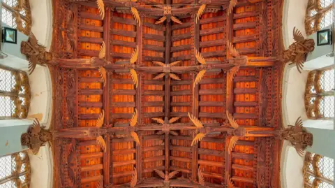 Mike Daines Wooden church ceiling containing decorated angels