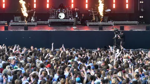 Crowds of fans in front of a stage during BBC Radio 1's Big Weekend festival in 2024.