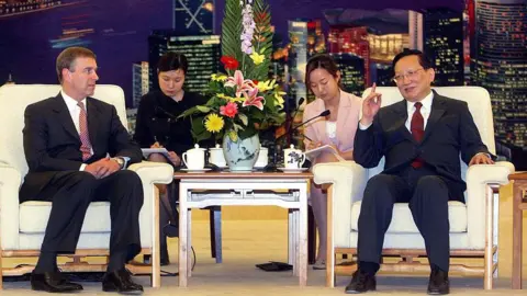 Getty Images A trade visit by the then Prince Andrew to China, with Andrew and his Chinese host and two translators all seated.