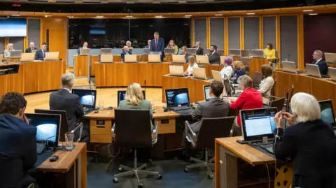 Senedd Cymru A wide   presumption    of the Senedd's debating chamber.