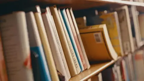 Getty Images A close-up photo of a shelf of books.