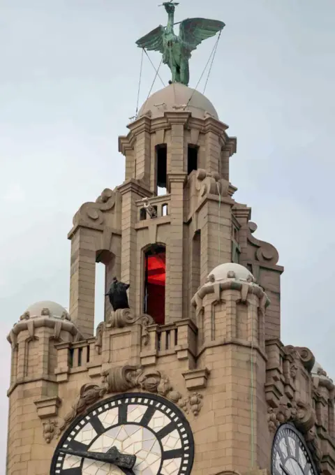Getty Images Batman on top of the Liver Building in Liverpool