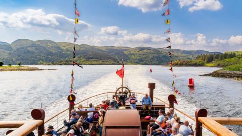NDY INGLIS Image caption, "What a day for the first sailing of the PS Waverley, passing through the Kyles of Bute," says Andy Inglis.