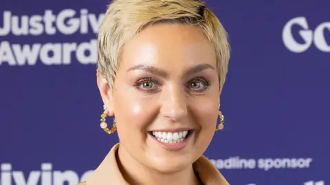 PA Media Amy Dowden smiling with short hair in May 2024
