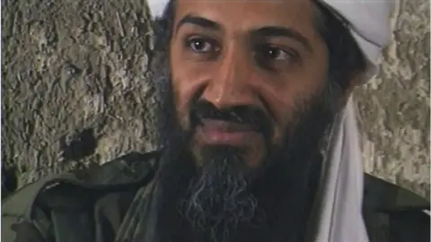 Getty Images Osama Bin Laden, the Saudi millionaire and fugitive leader of the terrorist group al Qaeda, explains why he has declared a "jihad" or holy war against the United States on August 20, 1998 from a cave hideout somewhere in Afghanistan.