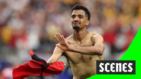 Hossam Abdelmaguid rips his shirt off after scoring the winning penalty for Egypt against Australia in the 2026 World Cup.