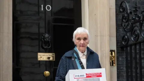 Campaign to End Frozen Pensions Anne Puckridge outside Downing Street