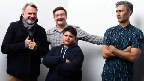 Getty Images Actors Sam Neill, Rhys Darby, Julian Dennison and writer/director Taika Waititi from the film "Hunt for the Wilderpeople" pose for a portrait during the WireImage Portrait Studio hosted by Eddie Bauer at Village at The Lift on January 22, 2016 in Park City, Utah