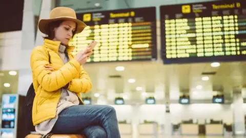 Getty Images Woman at the airport