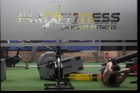 AFP/Getty Images A woman exercises in a gym in Christchurch on 14 May, 2020