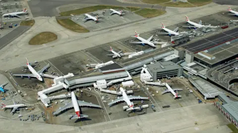 An aerial view of planes waiting on the tarmac at Heathrow