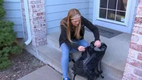 CBS Ms Tadlock shows where she was keeping the apple in question