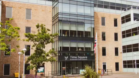 Getty Images A general view of Bracknell Forest Council's headquarters in Time Square in Bracknell, a five storey building which has a large glass frontage 