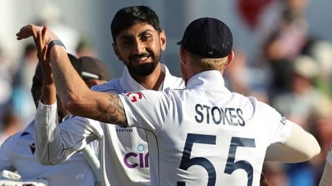 England's Shoaib Bashir celebrates a wicket with Ben Stokes in the second Test against West Indies