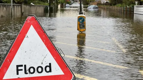 BBC Flood sign placed on Main Street