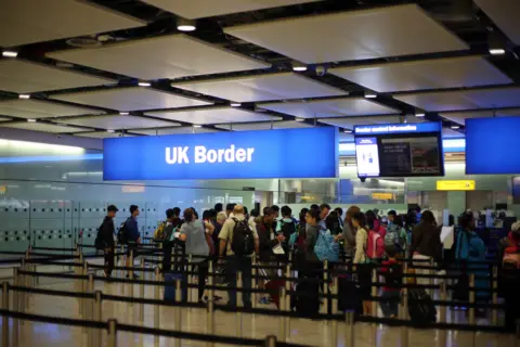 General view of passengers going through UK Border at Terminal 2 of Heathrow Airport