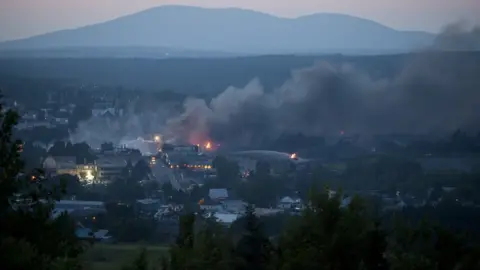 AFP Smoke seen rising from downtown Lac-Megantic