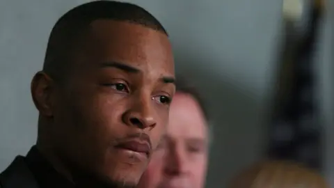 Getty Images Recording artist Clifford 'T.I.' Harris pauses during a press conference at the Richard B. Russell Federal Building March 27, 2009 in Atlanta, Georgia.