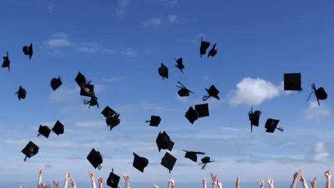 Getty Images Graduation mortar hats thrown in the air