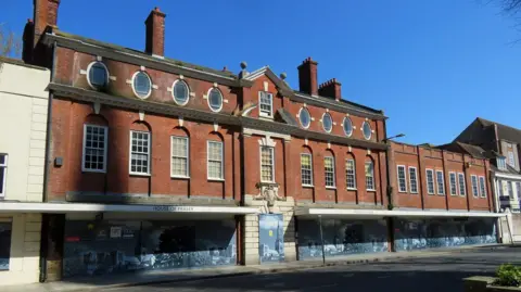 A red brick building. 