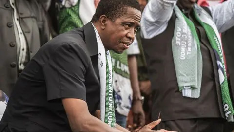 Getty Images Zambian President Edgar Lungu looks on during his presidential campaign closing rally on August 10, 2016 in Lusaka.