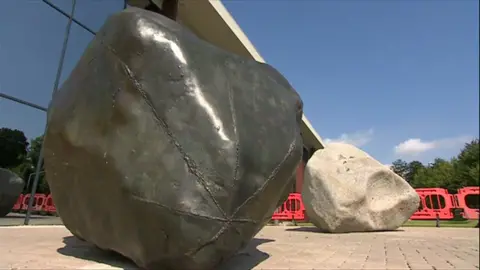 Two Stones, which consists of a large stone boulder and another large boulder, which is a bronze and concrete facsimile.