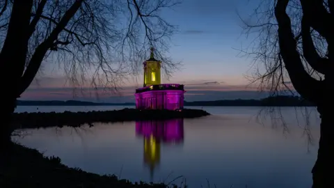 Richard Brown Normanton Church lit up to mark the anniversary of the UK's first Covid lockdown in March 2021