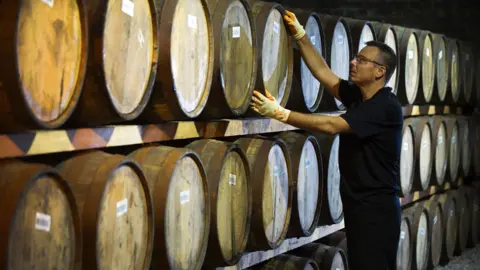 Getty Images Danny Borzacciello stores a barrel at the Auchentoshan Distillery