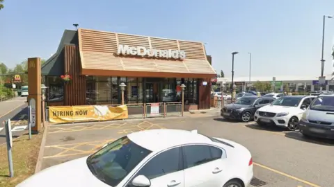A Google street view image of a McDonald's viewed from its car park.
