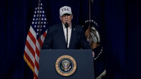 Donald Trump pictured delivering his address 