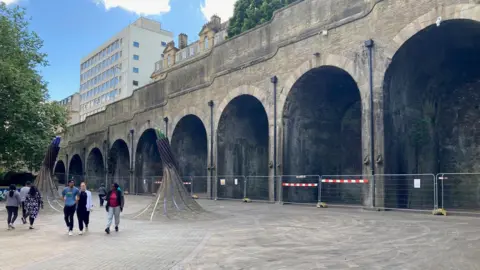 BBC A shot of the fenced-off archways at Bradford Forster Square Railway Station