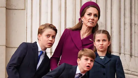 Aaron Chown/POOL/AFP via Getty Images Prince George, the Princess of Wales, Prince Louis and Princess Charlotte watch the Red Arrows flypast from Buckingham Palace balcony in 2025