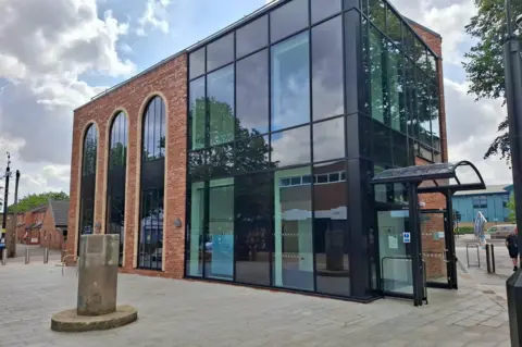 Derbyshire County Council A glass and brick building
