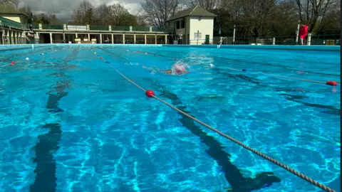 Emma Baugh / BBC Swimming Pool with swimmers in the water 