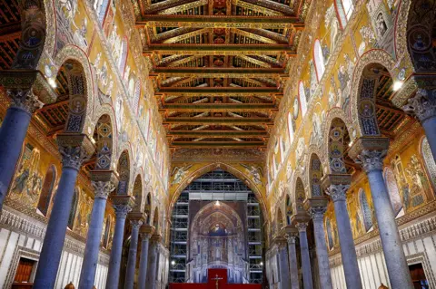 Reuters View of the central nave of Monreale's cathedral