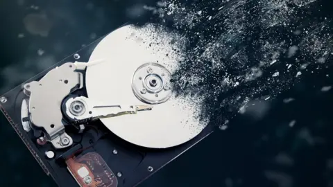 Creative image of hard drive disolving