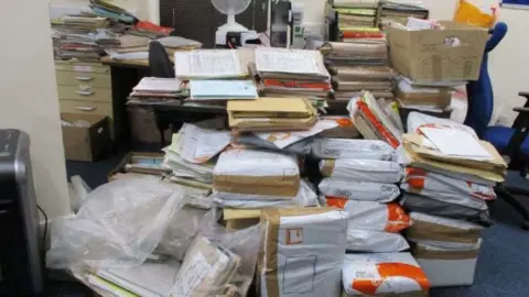 HM Inspectorate of Prisons Piles of paperwork